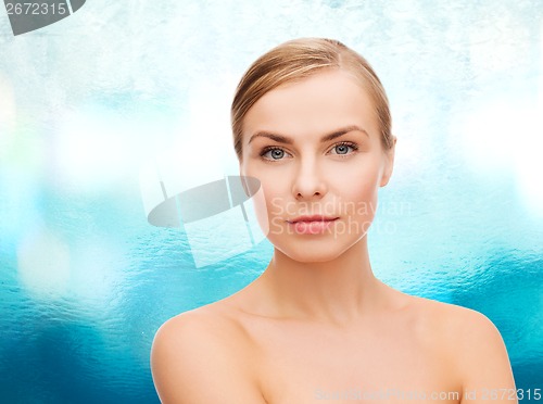 Image of face and shoulders of young woman