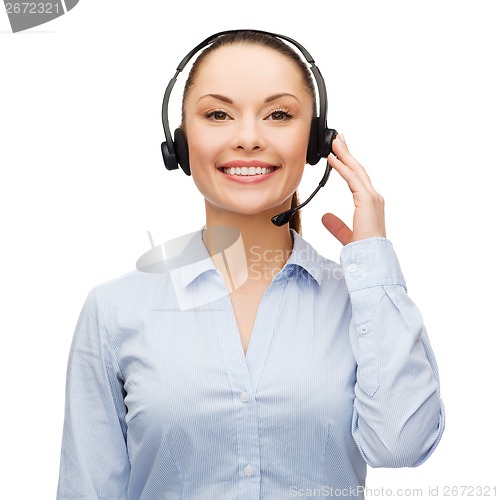 Image of friendly female helpline operator with headphones