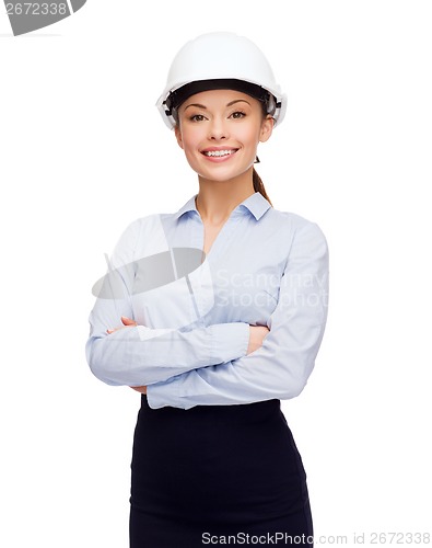 Image of friendly smiling businesswoman in white helmet