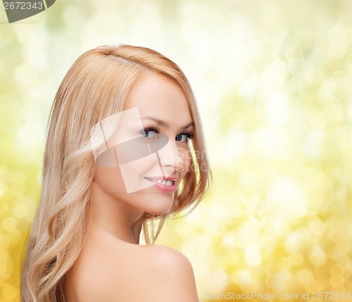 Image of face and shouldes of happy woman with long hair