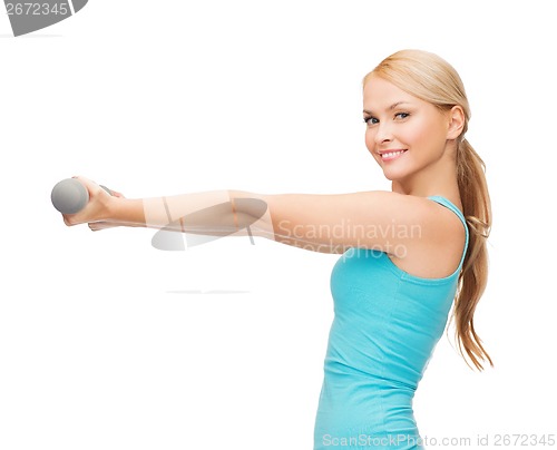 Image of young sporty woman with light dumbbells