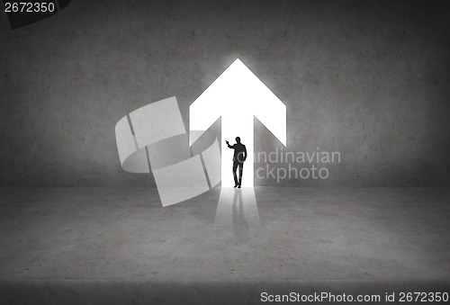 Image of silhouette if businesswoman in the arrow