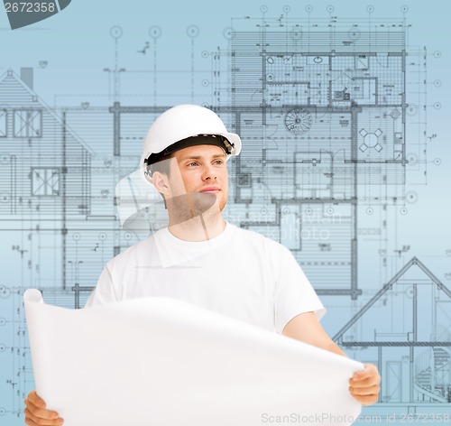 Image of male architect looking at blueprint
