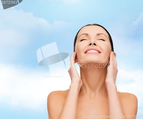 Image of face of young smiling woman
