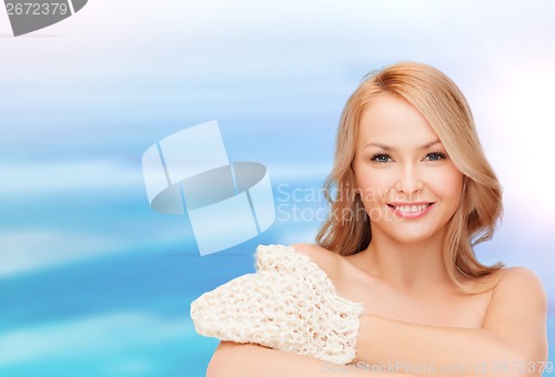 Image of smiling woman with exfoliation glove