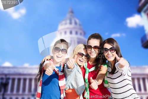 Image of teenage girls or young women showing thumbs up