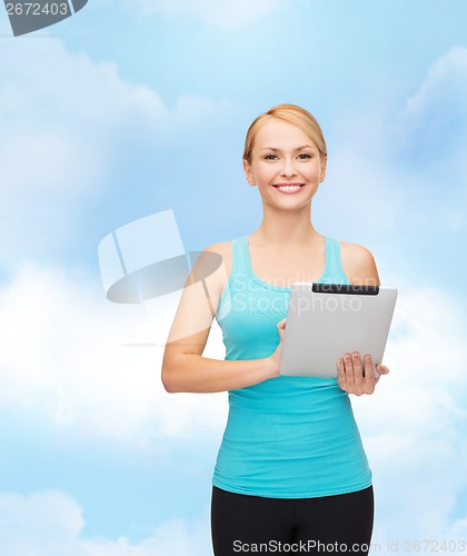 Image of sporty woman with tablet pc