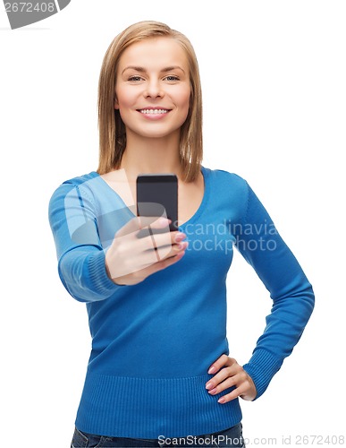 Image of woman taking self picture with smartphone camera