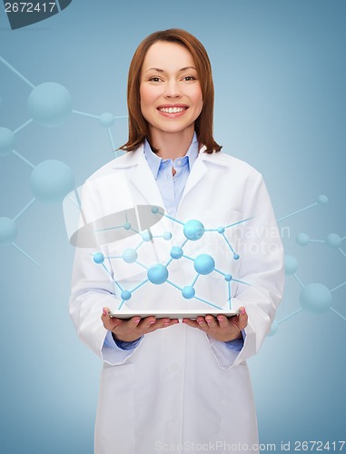 Image of smiling female doctor and tablet pc computer