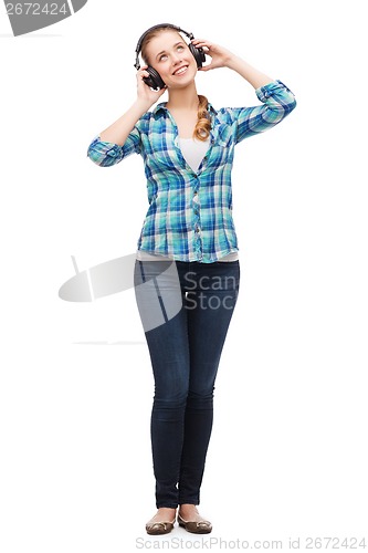 Image of young woman listeting to music with headphones