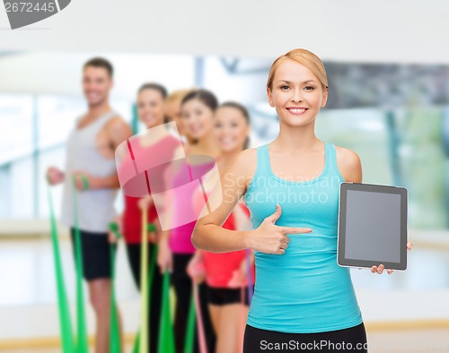 Image of sporty woman with tablet pc blank screen