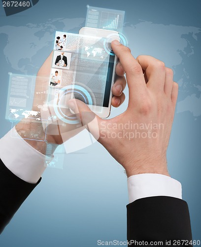 Image of businessman touching screen of smartphone