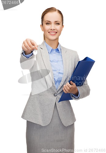 Image of smiling businesswoman with folder and keys