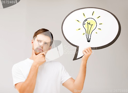 Image of young man with light bulb in text bubble