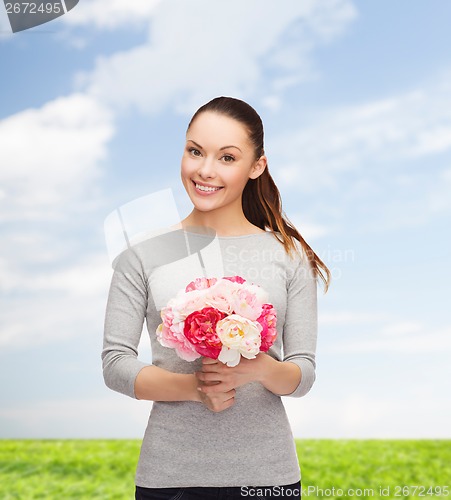 Image of young woman with bouquet of flowers