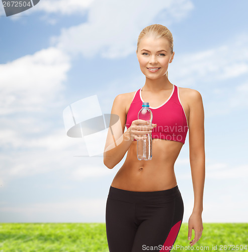 Image of smiling woman with bottle of water