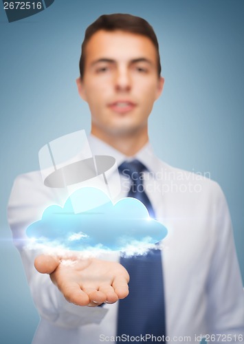 Image of friendly buisnessman showing cloud on the palm