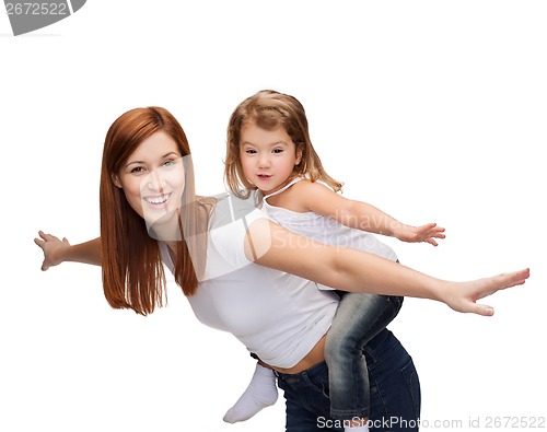 Image of happy mother and child doing piggy back