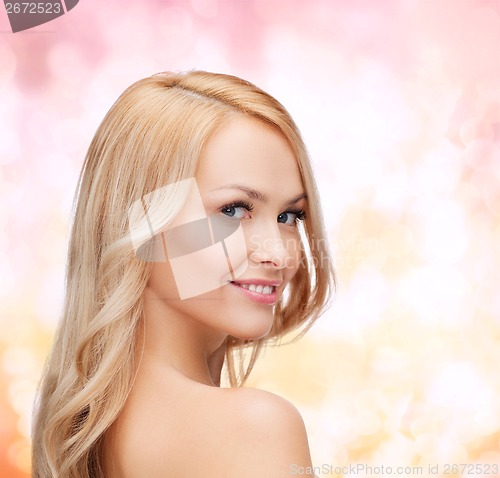 Image of face and shouldes of happy woman with long hair