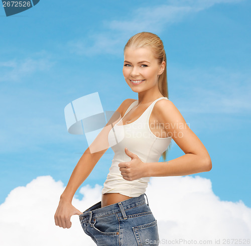 Image of sporty woman showing big pants