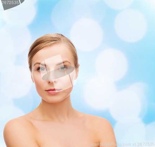 Image of face and shoulders of young woman
