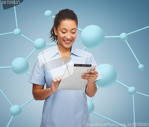 Image of smiling black doctor or nurse with tablet pc