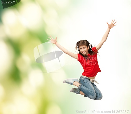 Image of smiling girl jumping