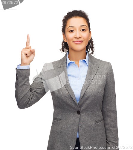 Image of smiling businesswoman with her finger up