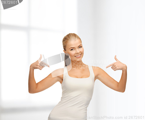 Image of woman in blank white t-shirt pointing at herself
