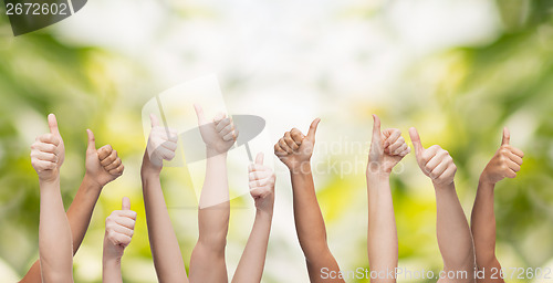 Image of human hands showing thumbs up