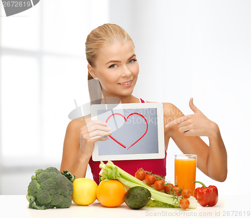 Image of woman with fruits, vegetables and tablet pc