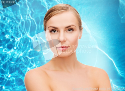 Image of face and shoulders of young woman