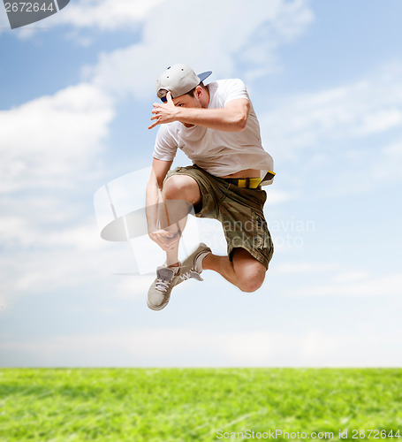 Image of male dancer jumping in the air