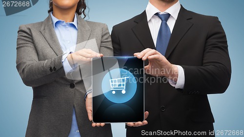 Image of businessman and businesswoman with tablet pc