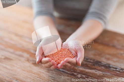 Image of cloes up of female cupped hands with quinoa