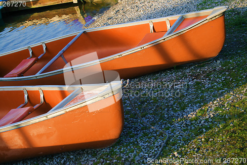 Image of canoes in the morning light