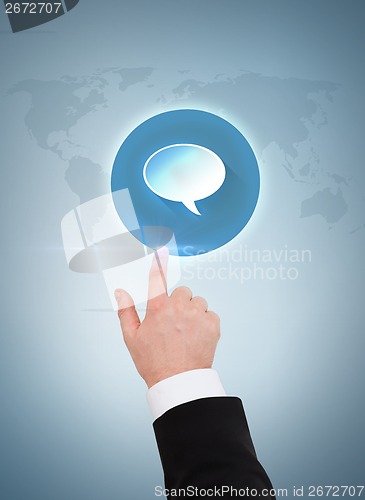 Image of close up of businessman pointing to text bubble