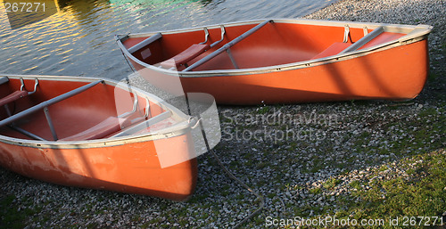 Image of canoes in the morning light
