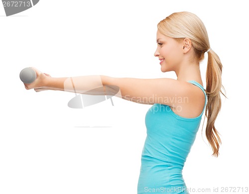 Image of young sporty woman with light dumbbells