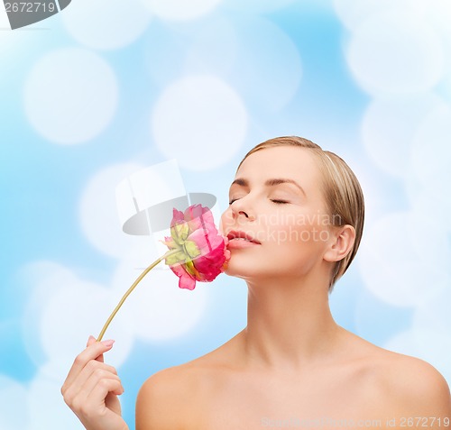 Image of lovely woman with peonie flower