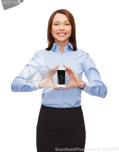 Image of smiling businesswoman with smartphone blank screen