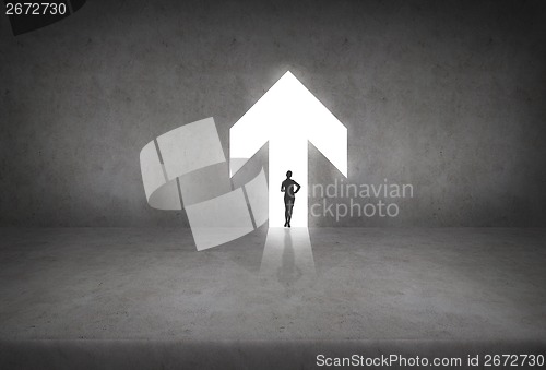 Image of silhouette if businesswoman in the arrow