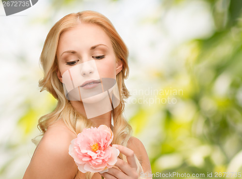 Image of lovely woman with peony flower