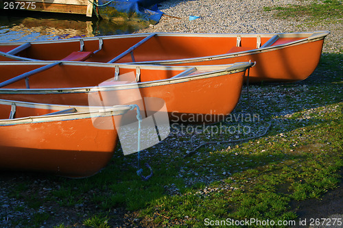 Image of canoes in the morning light