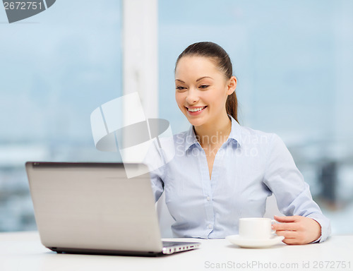 Image of smiling businesswoman or student with laptop