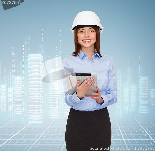Image of young smiling businesswoman in white helmet