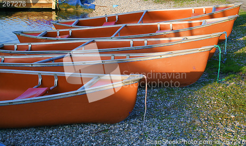 Image of canoes in the morning light