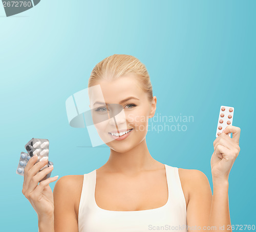 Image of young woman with pills