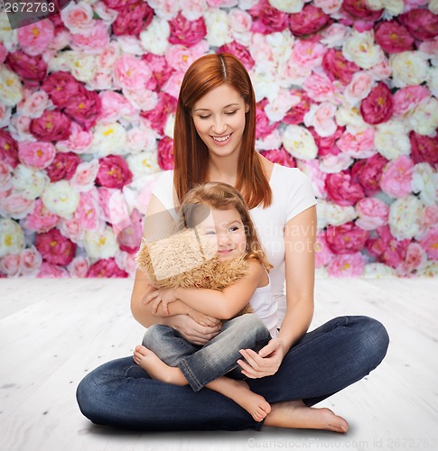 Image of happy mother with adorable girl and teddy bear