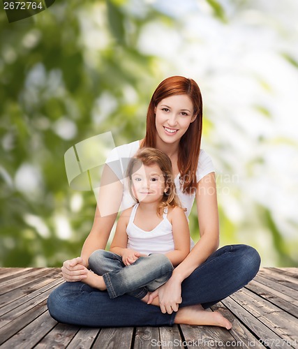 Image of happy mother with adorable little girl